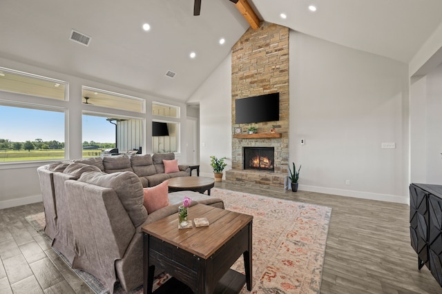 1196 Smith Rd, Ponder, TX 76259 - living area with high vaulted ceiling, beam ceiling, a fireplace, baseboards, and wood finished floors