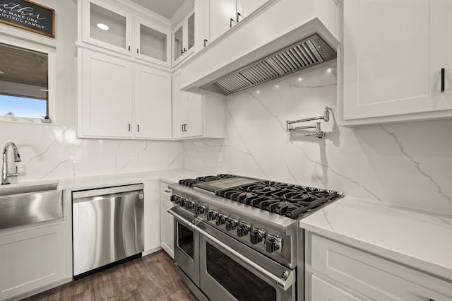 1196 Smith Rd, Ponder, TX 76259 - kitchen featuring stainless steel appliances, under cabinet range hood, a sink, and white cabinetry