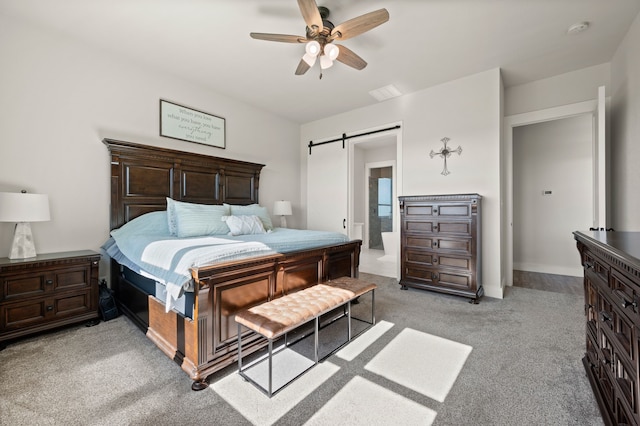 1196 Smith Rd, Ponder, TX 76259 - bedroom featuring a barn door, light colored carpet, ceiling fan, and ensuite bathroom