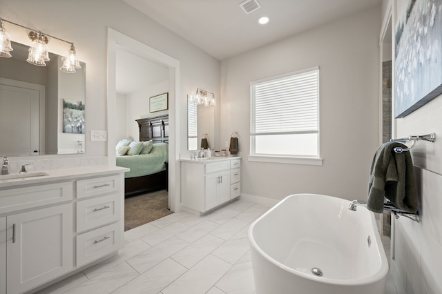 1196 Smith Rd, Ponder, TX 76259 - ensuite bathroom featuring two vanities and a freestanding bath