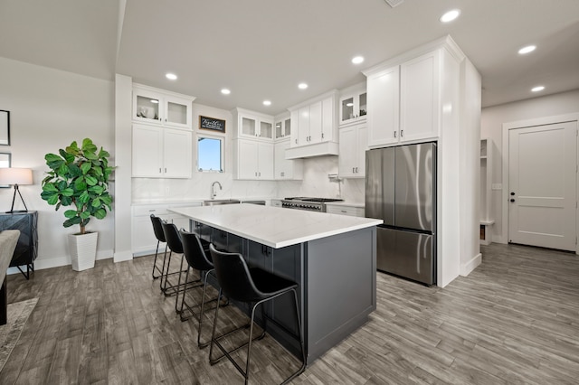 1196 Smith Rd, Ponder, TX 76259 - kitchen featuring stainless steel refrigerator, wood finished floors, a center island, baseboards, and recessed lighting