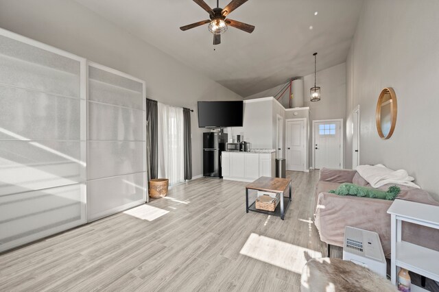 1196 Smith Rd, Ponder, TX 76259 - living area with high vaulted ceiling, ceiling fan, and light wood-style flooring