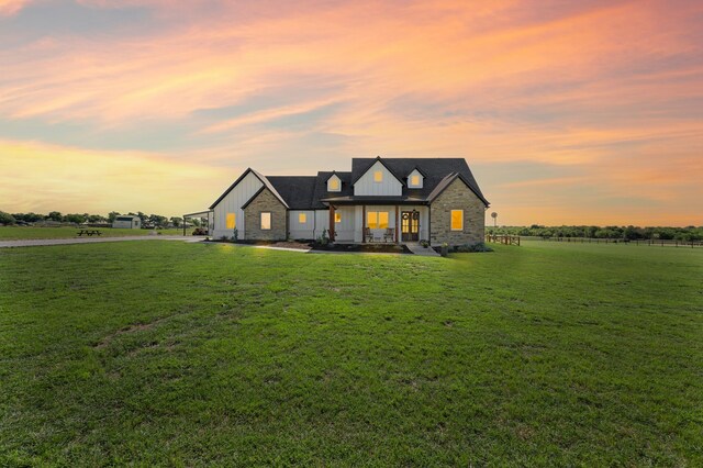 1196 Smith Rd, Ponder, TX 76259 - modern farmhouse style home featuring board and batten siding, a yard, and stone siding