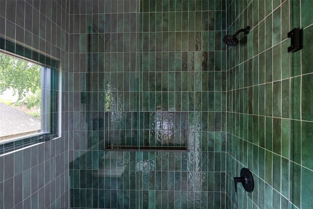 10026 Mccree Rd, Dallas, TX 75238 - bathroom featuring a tile shower and plenty of natural light