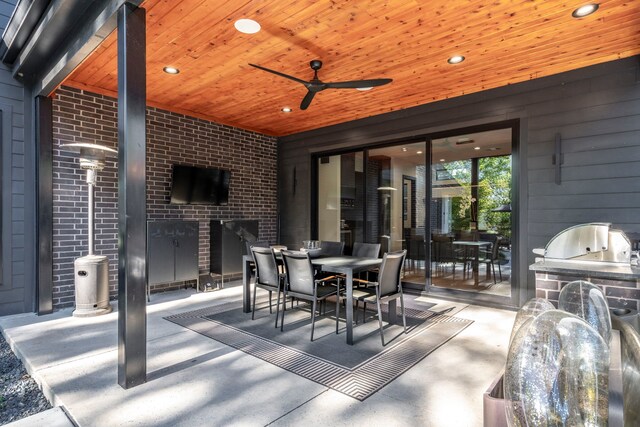 10026 Mccree Rd, Dallas, TX 75238 - view of patio / terrace with exterior kitchen, outdoor dining space, and a ceiling fan