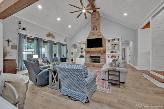 150 St Andrews Ln, Benton, LA 71006 - living room with arched walkways, a ceiling fan, high vaulted ceiling, a brick fireplace, and light wood-style flooring