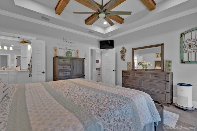 150 St Andrews Ln, Benton, LA 71006 - bedroom featuring wood finished floors, recessed lighting, beamed ceiling, ensuite bathroom, and baseboards
