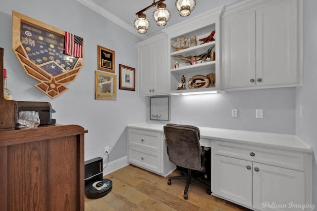 150 St Andrews Ln, Benton, LA 71006 - home office featuring built in desk, light wood finished floors, ornamental molding, a chandelier, and baseboards
