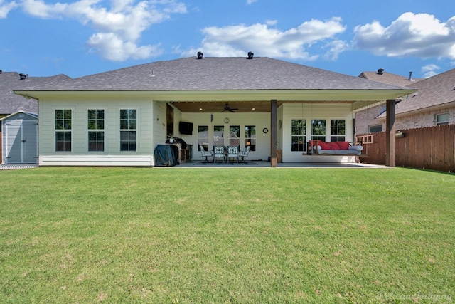 150 St Andrews Ln, Benton, LA 71006 - back of house featuring a ceiling fan, a patio, a storage unit, an outdoor hangout area, and an outdoor structure