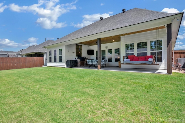 150 St Andrews Ln, Benton, LA 71006 - back of house featuring roof with shingles, an outdoor living space, a patio area, and central AC