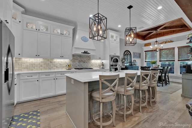 150 St Andrews Ln, Benton, LA 71006 - kitchen featuring a chandelier, light wood finished floors, stainless steel fridge, light countertops, and wood ceiling