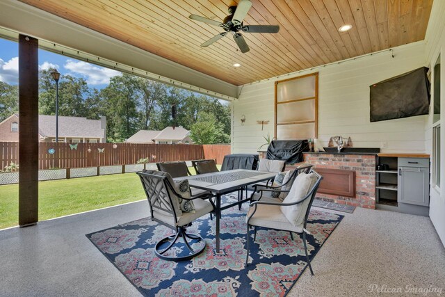150 St Andrews Ln, Benton, LA 71006 - view of patio with area for grilling, a ceiling fan, and outdoor dining area