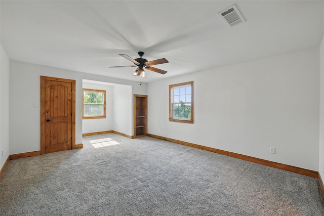 317 County Road 4790, Boyd, TX 76023 - unfurnished bedroom featuring baseboards, multiple windows, and carpet