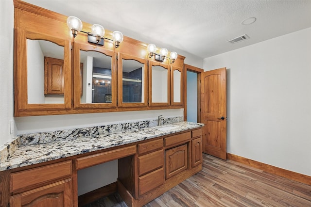 317 County Road 4790, Boyd, TX 76023 - full bath with wood finished floors, baseboards, and vanity