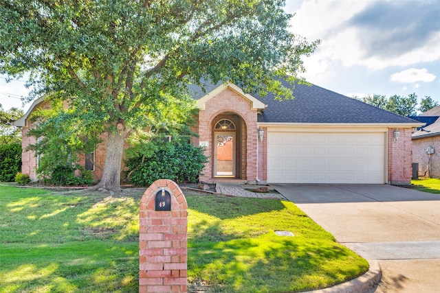 49 Sonora Dr, Trophy Club, TX 76262 - view of front of property with brick siding, roof with shingles, driveway, and a front lawn