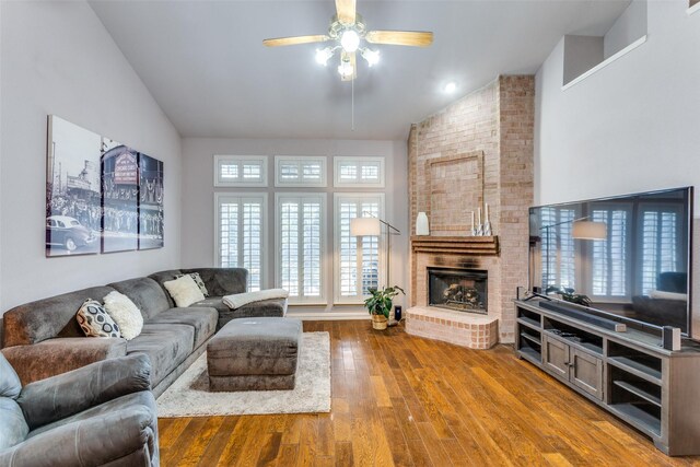 49 Sonora Dr, Trophy Club, TX 76262 - living area with lofted ceiling, a ceiling fan, wood finished floors, and a brick fireplace