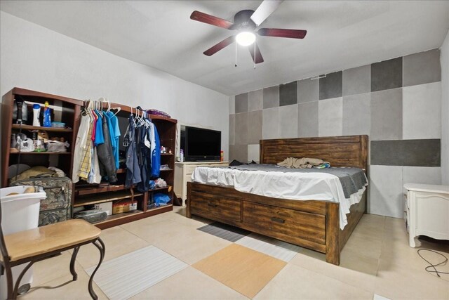 1474 Vz County Road 3810, Wills Point, TX 75169 - bedroom featuring ceiling fan and tile walls