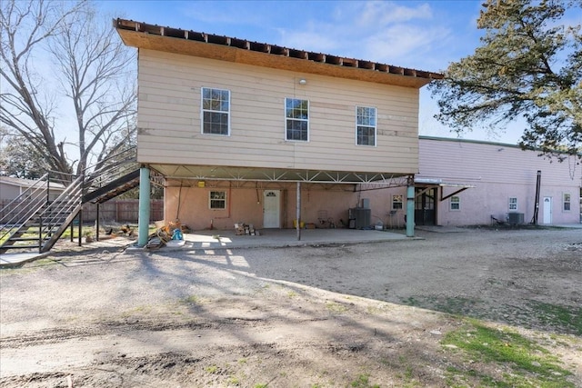 1474 Vz County Road 3810, Wills Point, TX 75169 - back of house featuring stairs, a patio area, central air condition unit, and driveway