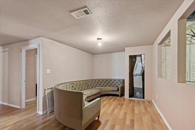 1474 Vz County Road 3810, Wills Point, TX 75169 - living area with wood finished floors, a textured ceiling, and baseboards