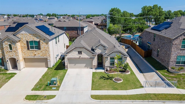 1106 Sassafras Dr, Princeton, TX 75407 - view of front of house featuring stone siding, driveway, and a residential view