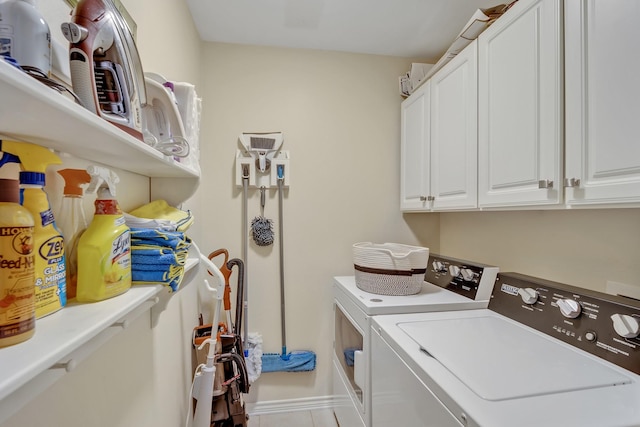 1521 Rice Rd Unit A101, Tyler, TX 75703 - clothes washing area featuring independent washer and dryer, cabinet space, and tile patterned flooring