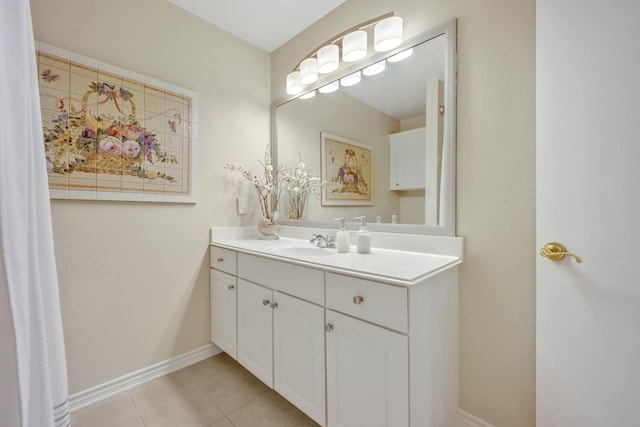 1521 Rice Rd Unit A101, Tyler, TX 75703 - bathroom featuring tile patterned flooring, vanity, and baseboards