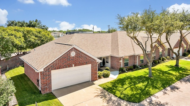 1521 Rice Rd Unit A101, Tyler, TX 75703 - view of front of property featuring brick siding, driveway, an attached garage, and a front lawn