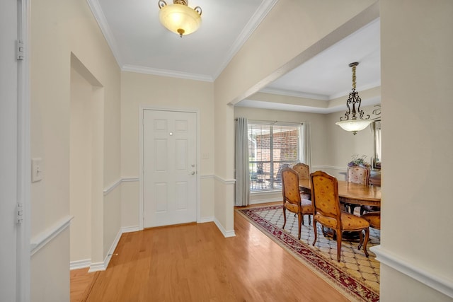 1521 Rice Rd Unit A101, Tyler, TX 75703 - foyer featuring light wood-style floors, ornamental molding, and baseboards