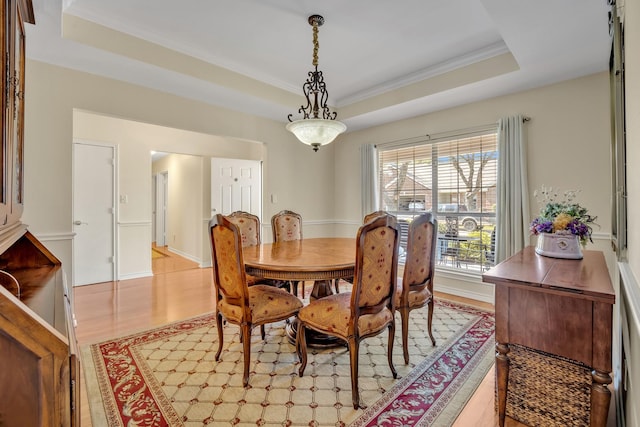 1521 Rice Rd Unit A101, Tyler, TX 75703 - dining room with a raised ceiling, light wood-type flooring, and ornamental molding