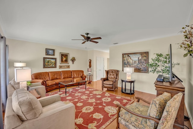 1521 Rice Rd Unit A101, Tyler, TX 75703 - living area with ceiling fan, wood finished floors, crown molding, and baseboards