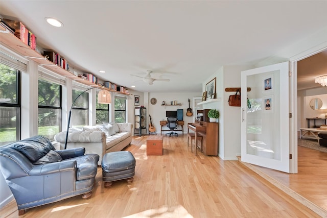living room featuring plenty of natural light, a desk, ceiling fan, light wood-type flooring, and recessed lighting