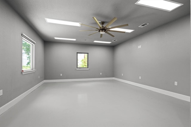 919 Old Justin Rd, Argyle, TX 76226 - empty room featuring concrete flooring, healthy amount of natural light, and a ceiling fan