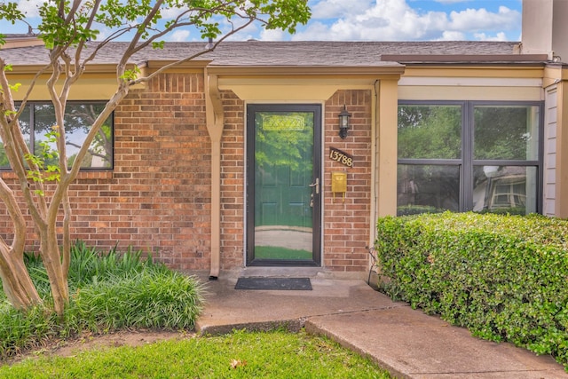 13788 Brookgreen Cir, Dallas, TX 75240 - doorway to property featuring brick siding