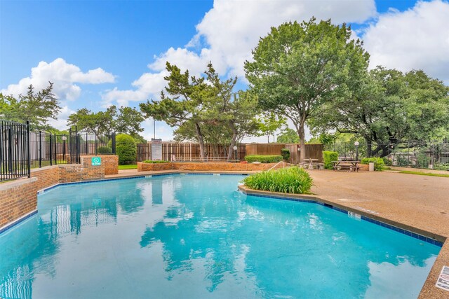 13788 Brookgreen Cir, Dallas, TX 75240 - community pool with fence and a patio