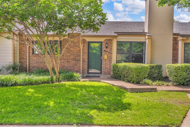 13788 Brookgreen Cir, Dallas, TX 75240 - view of front of property featuring a front lawn, brick siding, and roof with shingles