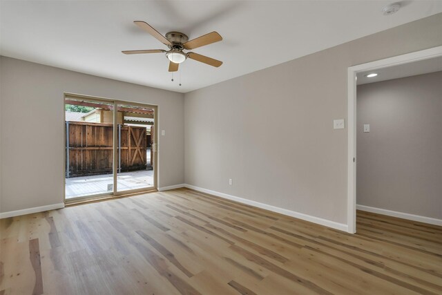 13788 Brookgreen Cir, Dallas, TX 75240 - empty room with light wood-style flooring, a ceiling fan, a smoke detector, and baseboards