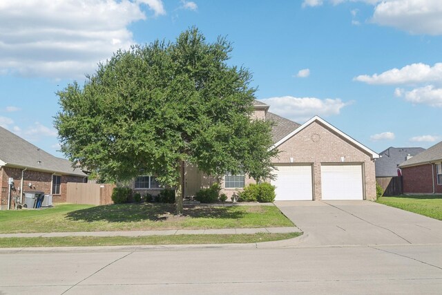 2929 Aurora Mist Dr, Little Elm, TX 75068 - view of front facade with brick siding, a garage, and driveway
