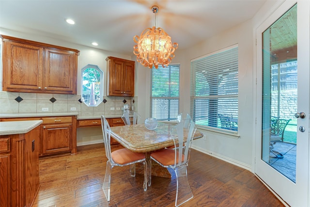 2621 Elmbrook Dr, Carrollton, TX 75010 - dining space featuring a chandelier, hardwood / wood-style floors, plenty of natural light, recessed lighting, and baseboards