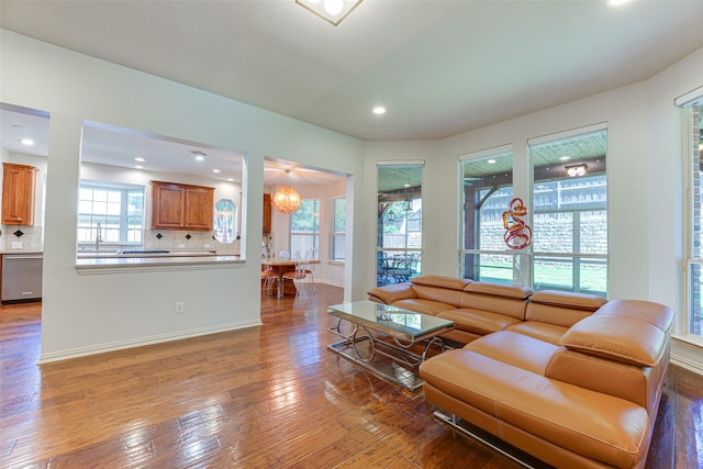 2621 Elmbrook Dr, Carrollton, TX 75010 - living room featuring wood-type flooring, healthy amount of natural light, recessed lighting, baseboards, and a chandelier