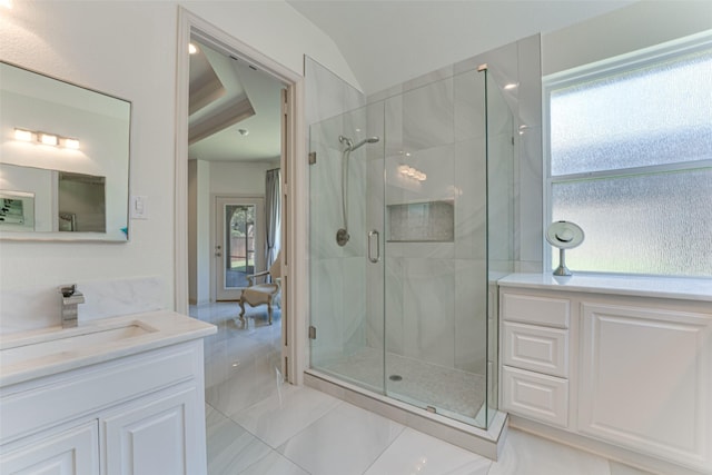 2621 Elmbrook Dr, Carrollton, TX 75010 - bathroom with a shower stall, vanity, tile patterned flooring, and vaulted ceiling