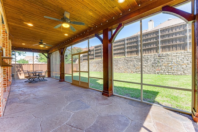 2621 Elmbrook Dr, Carrollton, TX 75010 - unfurnished sunroom featuring ceiling fan, plenty of natural light, and outdoor dining space