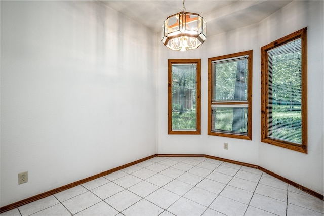 348 Indian Trl, Decatur, TX 76234 - spare room featuring a chandelier, baseboards, and light tile patterned flooring