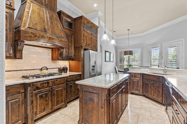 kitchen featuring appliances with stainless steel finishes, a sink, ornamental molding, tasteful backsplash, and custom exhaust hood