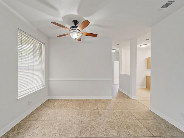 2500 Westheimer Rd, Denton, TX 76210 - spare room with ceiling fan, light tile patterned floors, and baseboards