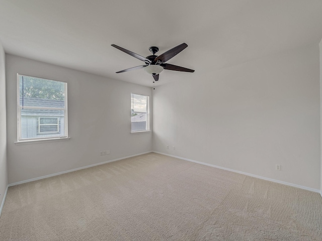 2500 Westheimer Rd, Denton, TX 76210 - empty room with baseboards, light colored carpet, and a ceiling fan