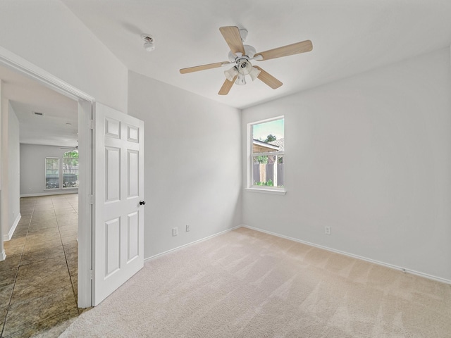 2500 Westheimer Rd, Denton, TX 76210 - unfurnished room with healthy amount of natural light, baseboards, ceiling fan, and carpet flooring