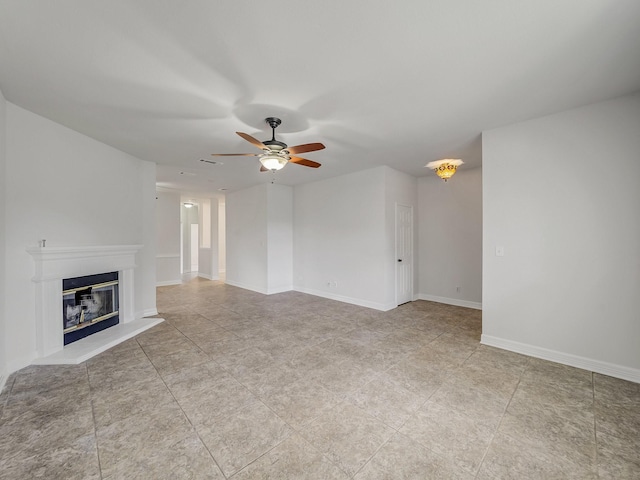 2500 Westheimer Rd, Denton, TX 76210 - unfurnished living room with ceiling fan, a glass covered fireplace, and baseboards