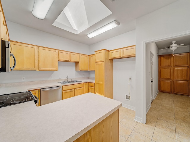 2500 Westheimer Rd, Denton, TX 76210 - kitchen featuring appliances with stainless steel finishes, light brown cabinetry, a sink, light tile patterned floors, and light countertops