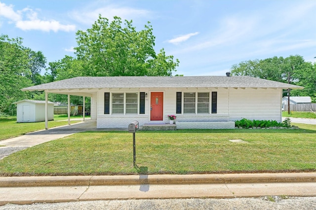 501 S Eddy Ave, Denison, TX 75020 - ranch-style house featuring a storage shed, concrete driveway, an outdoor structure, a carport, and roof with shingles