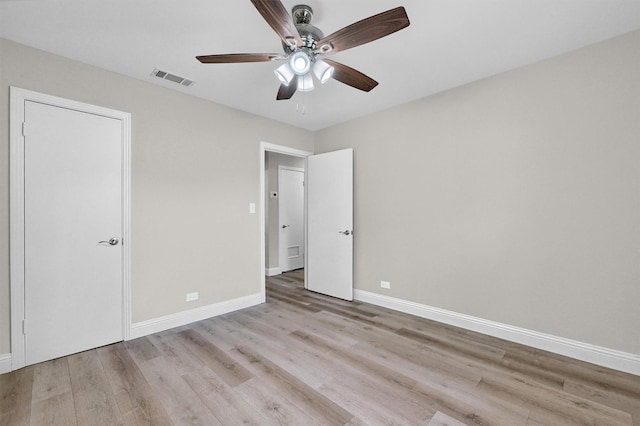 501 S Eddy Ave, Denison, TX 75020 - unfurnished bedroom featuring wood finished floors and a ceiling fan